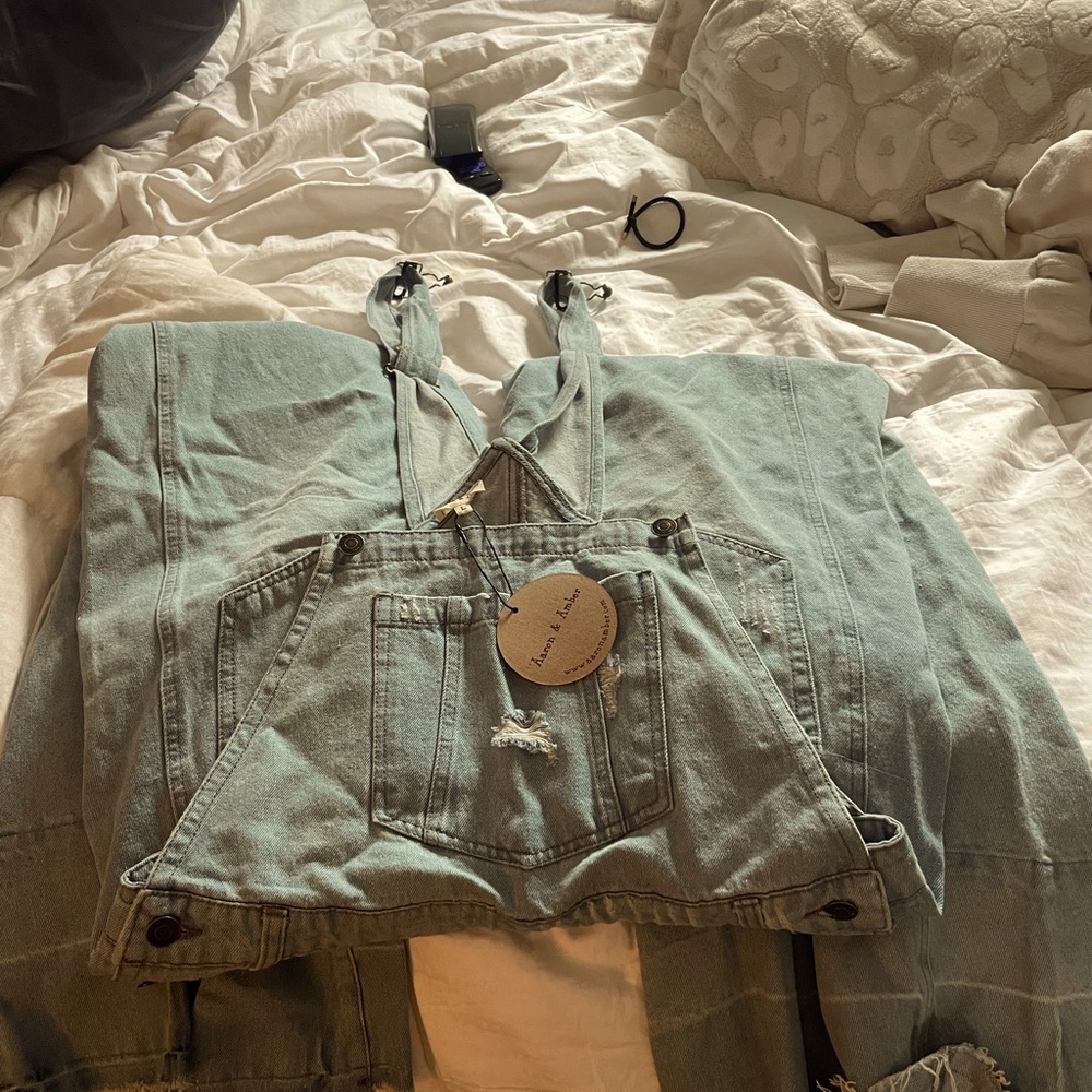These Jean overalls are so cute! Bell bottom, unfinished hem, boho casual